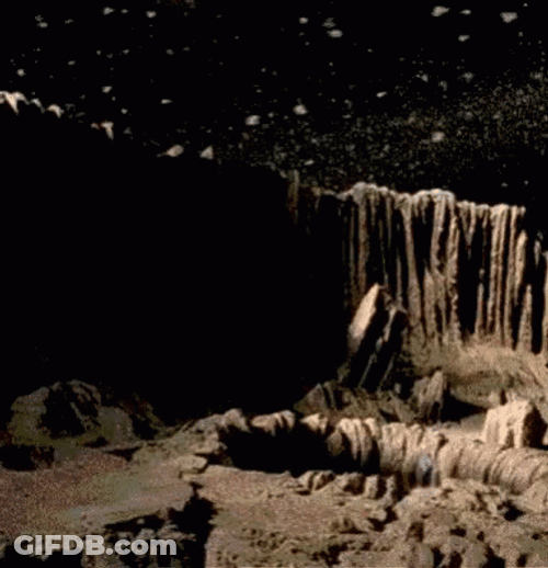 Space Big Worm Peeking From Hole GIF