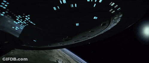 Spaceship Flying Over Earth GIF