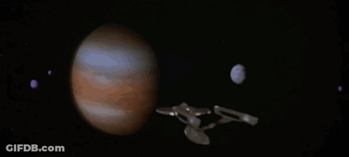 Spaceship Flying Over Planet With Crescent Moon GIF