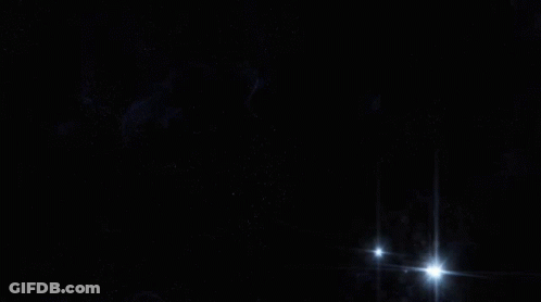 Spaceships Flying Over Planet GIF