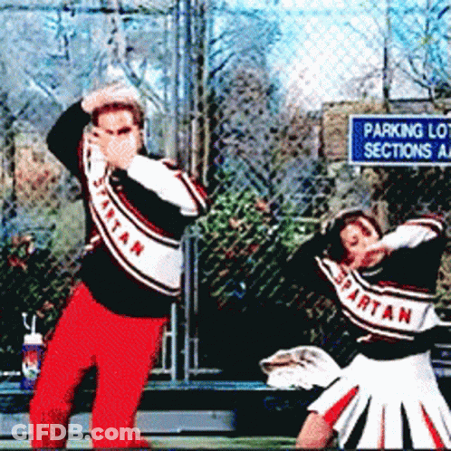 Spartan Cheerleaders Dancing In Front Of A Parking Lot Sections Sign GIF