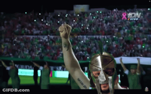 Spartan Helmet Man Raising Fist At Crowd GIF