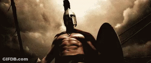 Spartan Man Holding Shield And Sword GIF