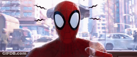 Spider-Man Is Sitting In Front Of A Window With A City In The Background And A Car In The Background . GIF