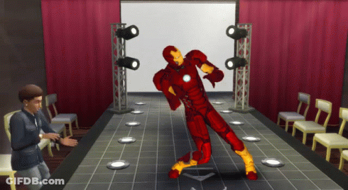 Spiderman Suit Standing Next To Iron Man Suit GIF