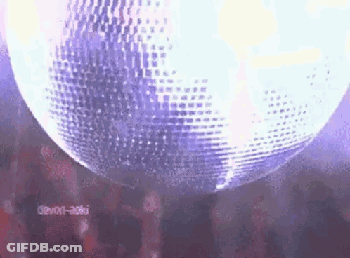 Spinning Disco Ball In Dark Room GIF