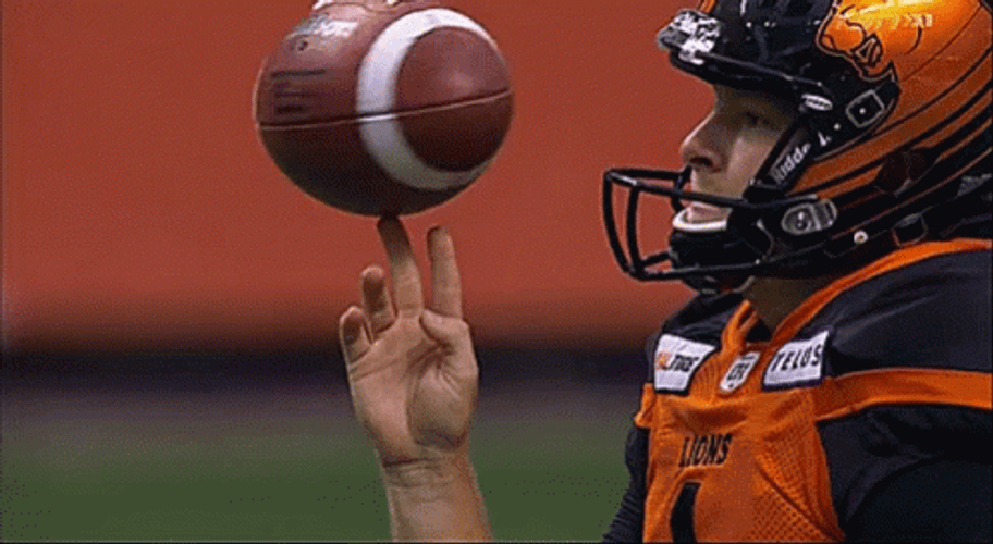 Spinning Football Catch GIF