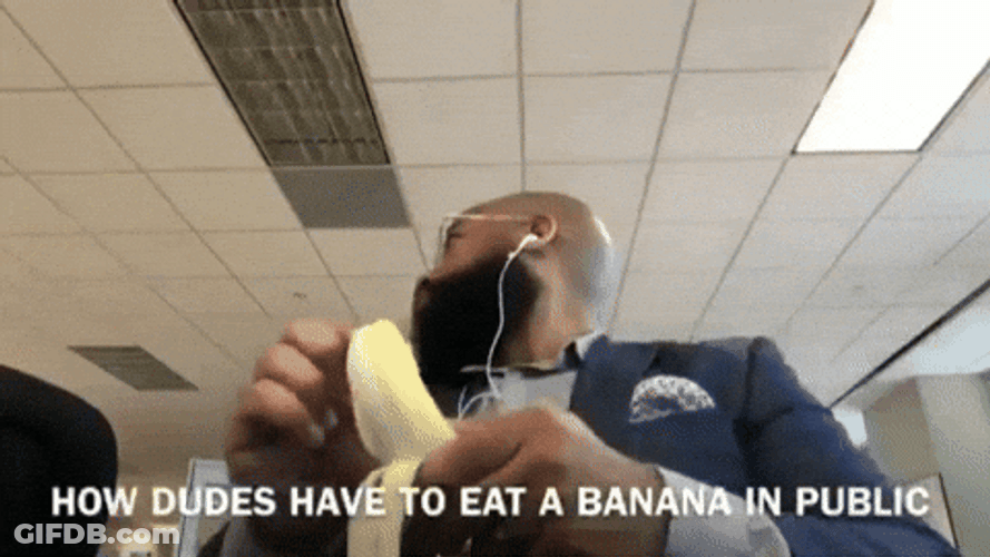Spinning Office Guy Peeling Banana GIF