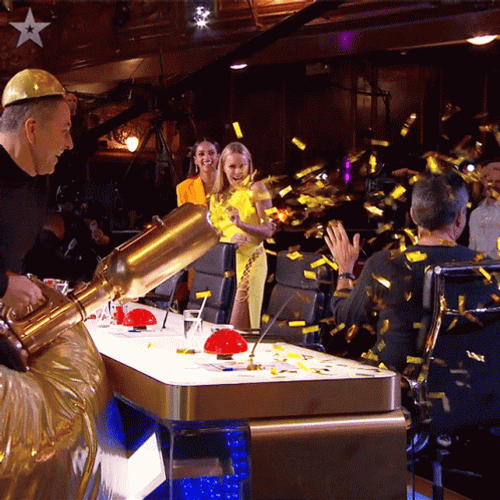 Splashing The Confetti Cannon To Simon Cowell GIF