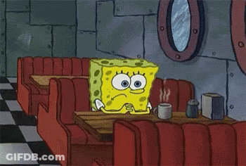 Spongebob Is Sitting At A Table In A Diner With A Cup Of Coffee GIF