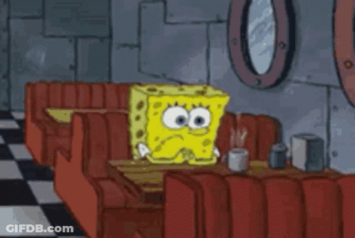 SpongeBob Sitting At Table In Diner With Cup Of Coffee GIF
