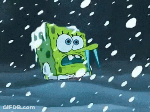 Spongebob Squarepants Is Covered In Ice And Snow While Holding An Icicle In His Mouth . GIF