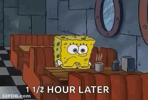 Spongebob Squarepants Is Sitting At A Diner Table With A Cup Of Coffee . GIF