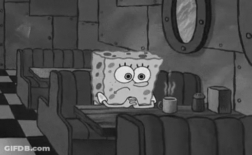 Spongebob Squarepants Is Sitting At A Table In A Diner Holding A Cup Of Coffee . GIF