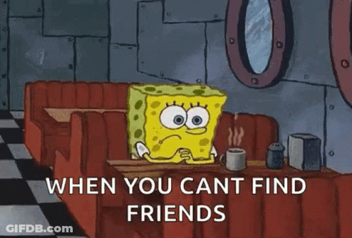 Spongebob Squarepants Is Sitting At A Table With A Cup Of Coffee . GIF