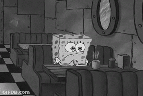 SpongeBob SquarePants Sitting At Diner Table Holding Coffee GIF