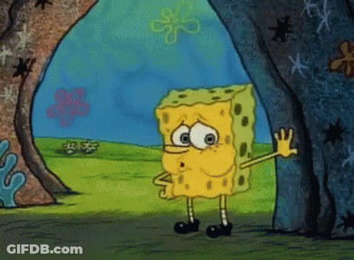 SpongeBob Standing In Front Of A Rock GIF