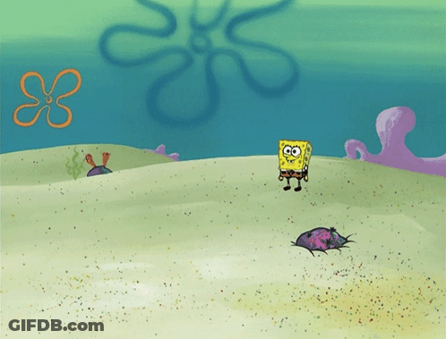 SpongeBob Standing In Sand Near Flower GIF