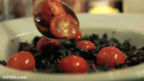 Spoonful Of Tomatoes Poured Into Bowl Of Vegetables GIF