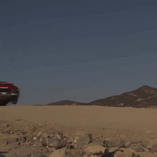 Sports Car Flying Over Dirt GIF