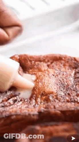 Spreading Icing On French Toast With Powdered Sugar GIF