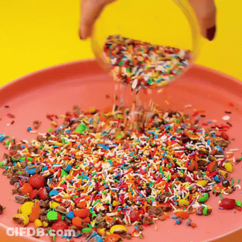Sprinkles Poured Into Pink Plate GIF