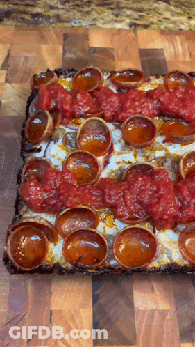 Square Pizza With Pepperoni And Tomato Sauce GIF