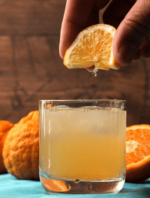 Squeezing Orange On Margarita GIF