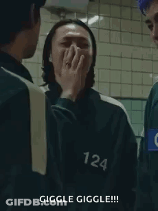 Squid Game Man Covering Mouth Laughing GIF
