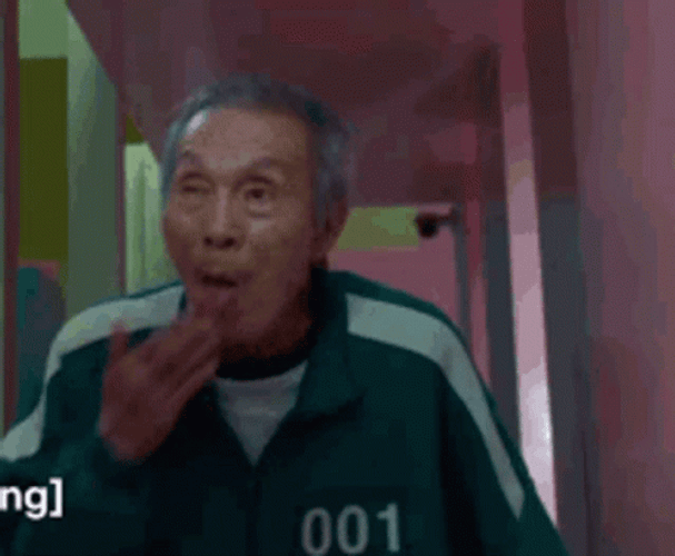 Squid Game Oh Il-Nam Licking Palm GIF