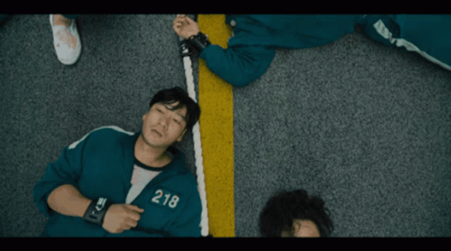 Squid Game Players On The Floor GIF