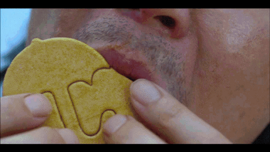 Squid Game Seong Gi-Hun Licking Cookie GIF