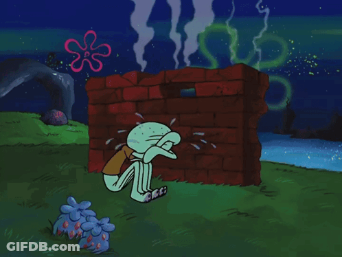 Squidward Crying In Front Of Red Brick Wall GIF