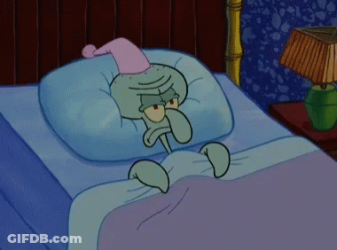 Squidward From Spongebob Is Laying In Bed Wearing A Pink Nightcap GIF