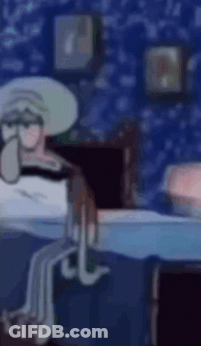 Squidward From Spongebob Squarepants Is Sitting On A Bed In A Room . GIF