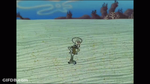 Squidward From Spongebob Squarepants Is Standing In The Sand On The Beach GIF