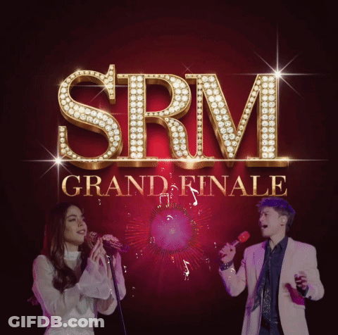 SRM Grand Finale Man And Woman Singing Into Microphones GIF