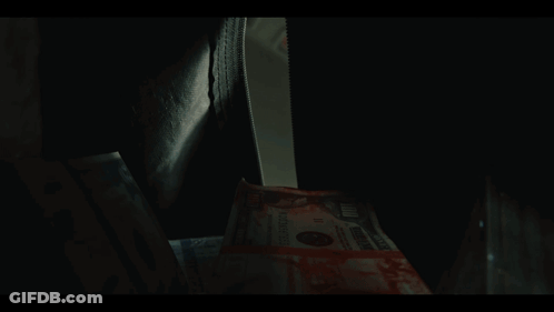 Stack Of 100 Dollar Bills With Bloody Face GIF