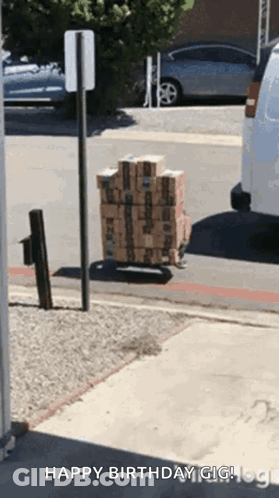 Stack Of Boxes On Cart Saying Happy Birthday Gig GIF