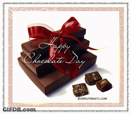 Stack Of Chocolate Boxes With Red Bow GIF