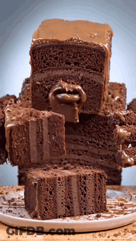 Stack Of Chocolate Cakes With Slice Missing GIF