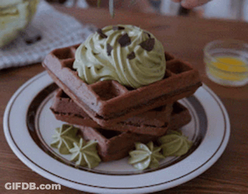Stack Of Chocolate Waffles With Green Frosting And Chocolate Chips GIF