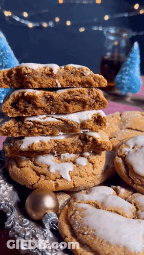Stack Of Cookies With One Missing A Bite GIF