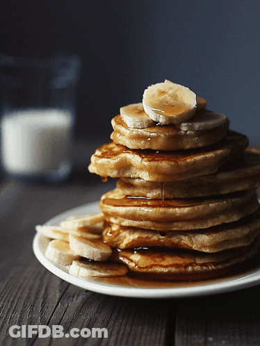 Stack Of Pancakes With Bananas And Syrup GIF