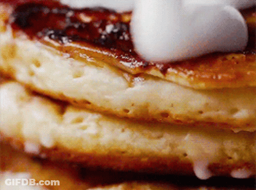 Stack Of Pancakes With Syrup And Whipped Cream GIF
