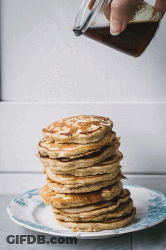 Stack Of Pancakes With Syrup Being Poured GIF