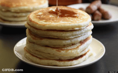 Stack Of Pancakes With Syrup Being Poured GIF