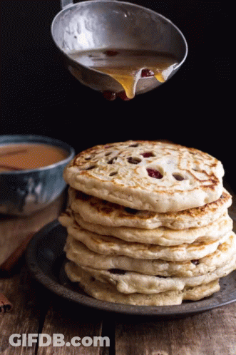 Stack Of Pancakes With Syrup Being Poured GIF