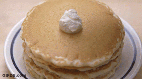 Stack Of Pancakes With Whipped Cream GIF
