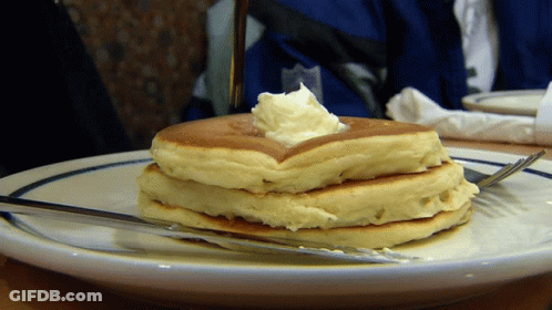 Stack Of Pancakes With Whipped Cream GIF